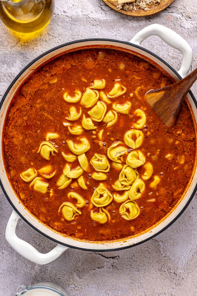 tortellini in a tomato-based soup.