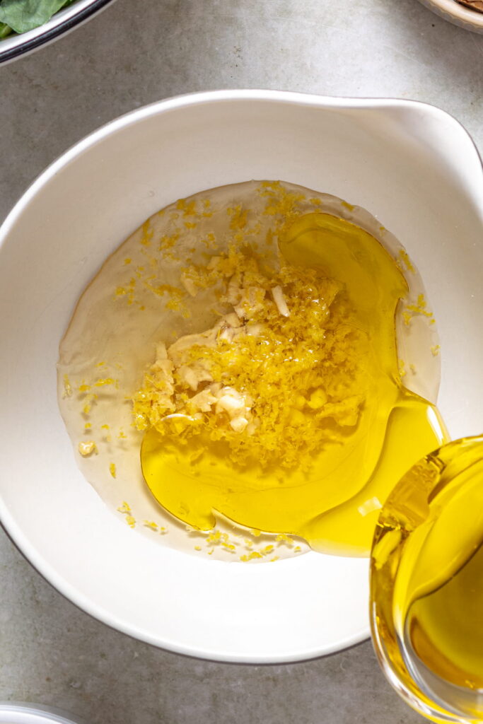 chickpea kale salad dressing being made in a bowl
