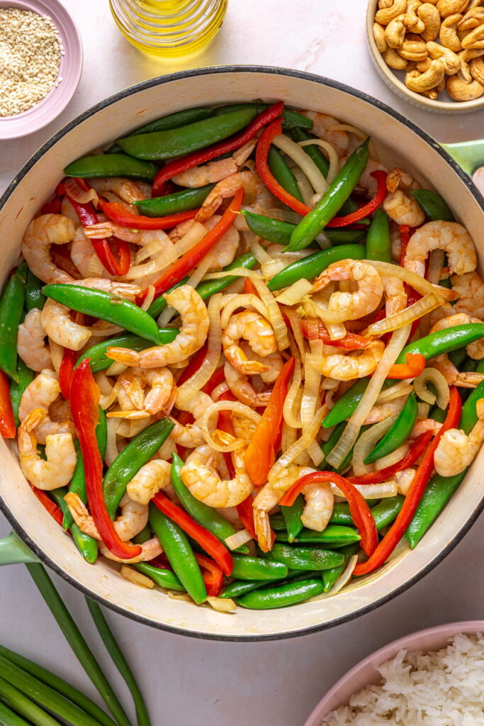 shrimp stir fry in a wok with veggies