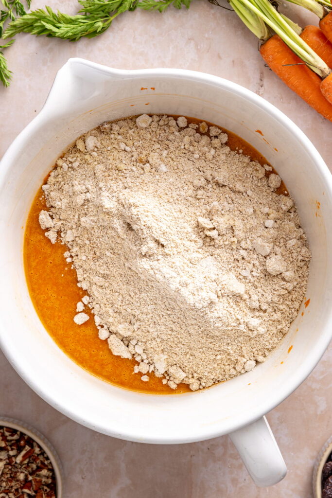 dry ingredients added to wet ingredients for gluten free carrot cake