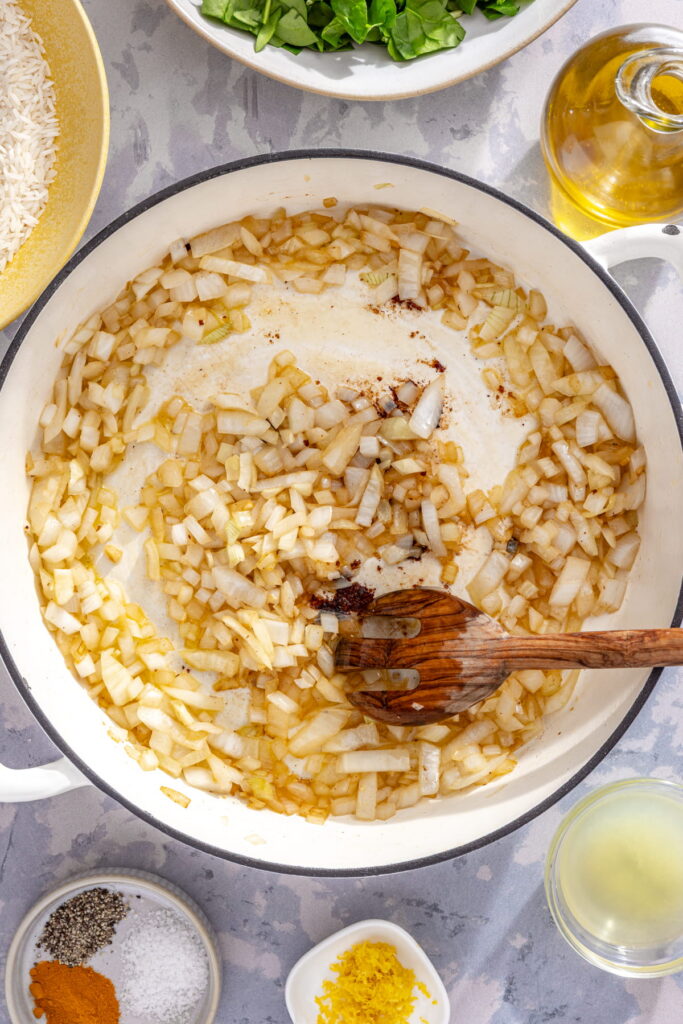onion and garlic frying in a pan