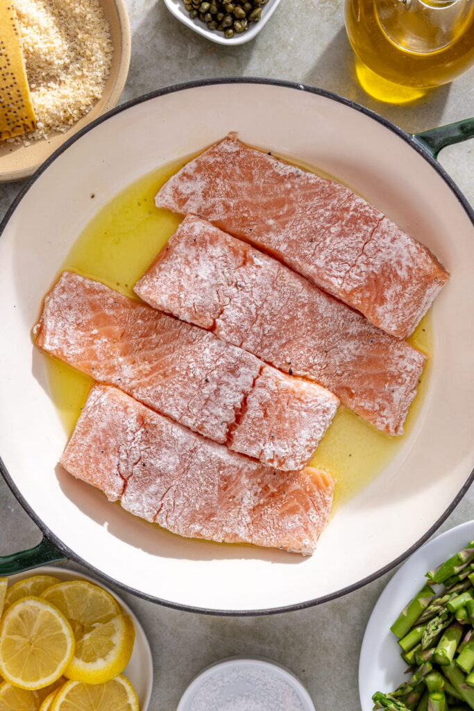 salmon cooking in pan
