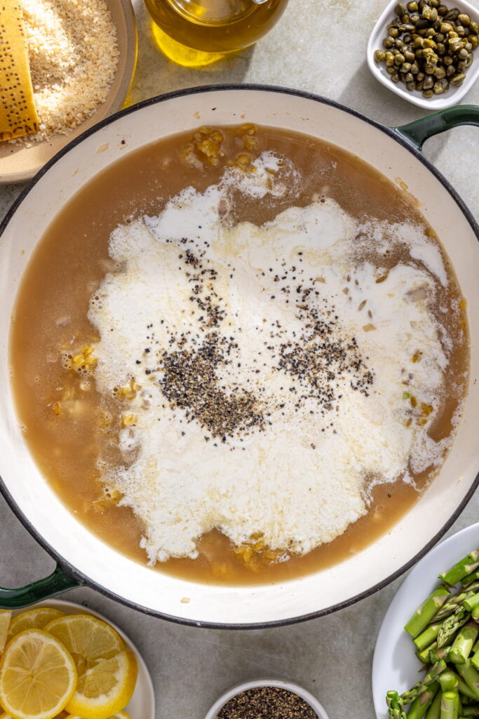 cream added to pan with orzo