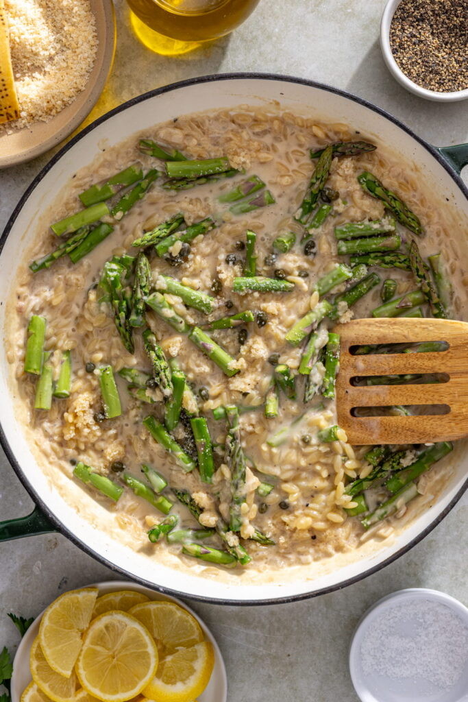asparagus, capers, and cheese added to orzo pan
