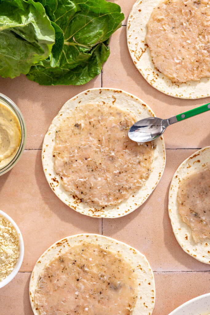 ground chicken spread on flour tortillas