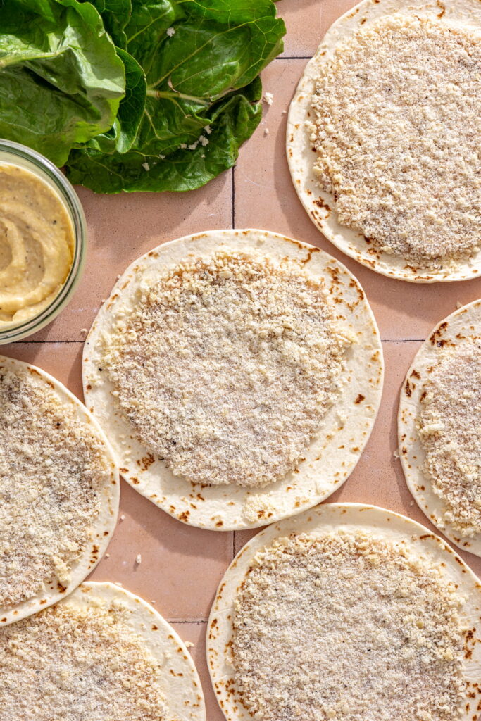 ground chicken spread on flour tortillas coated in panko and cheese
