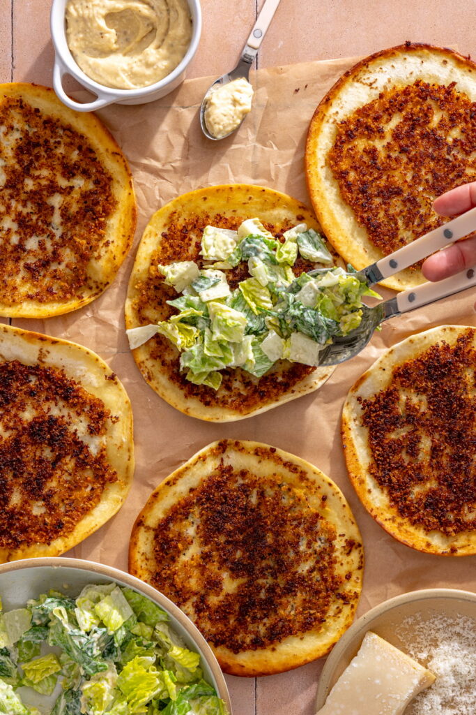 topping chicken smash tacos with caesar salad