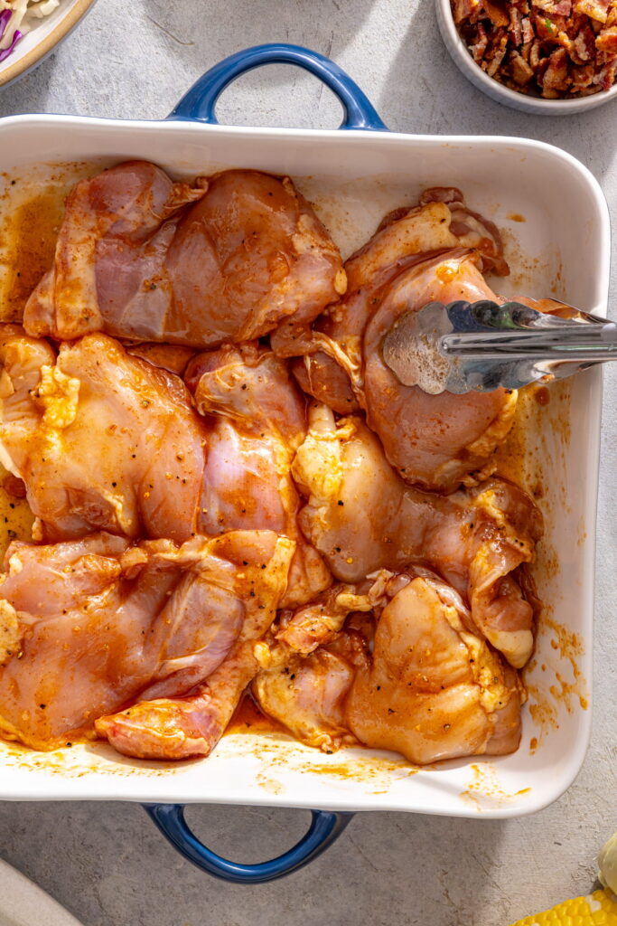 chicken marinating in a dish