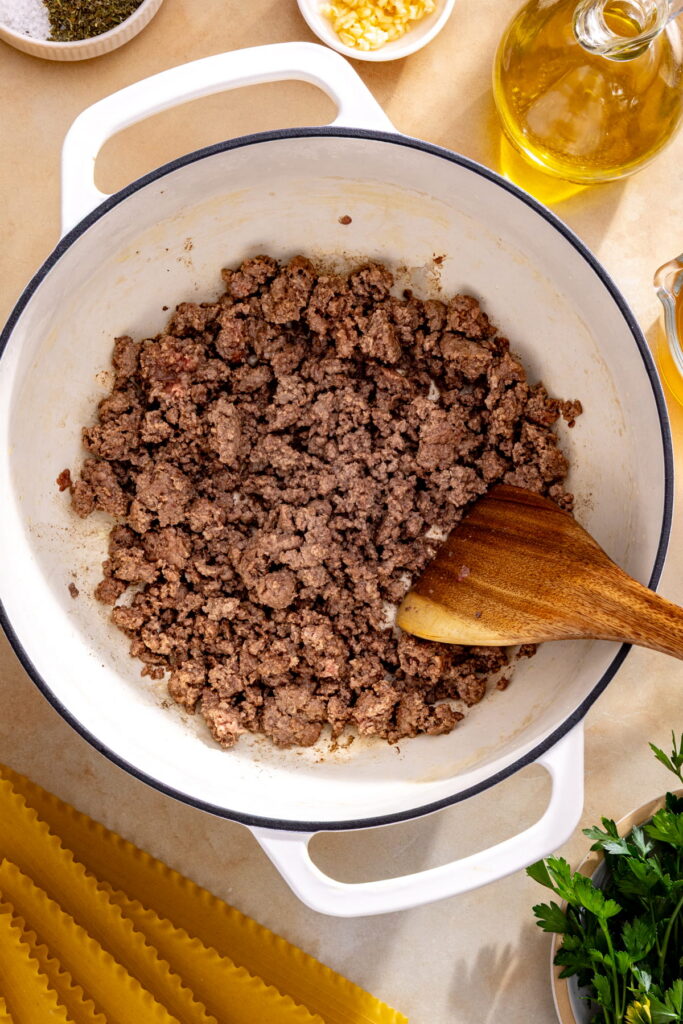 ground beef browning in a pan