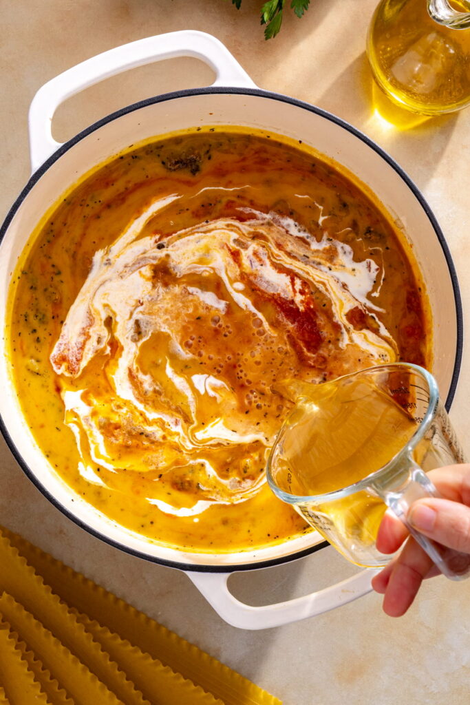butternut squash lasagna soup ingredients in a pot