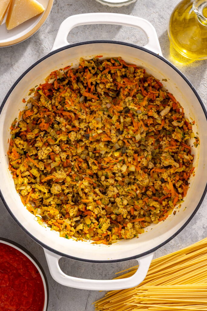 ground meat and veggies cooking in a pot